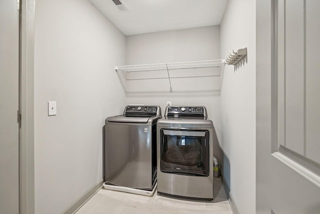 2342 N Tennessee Blvd Unit 1203, Murfreesboro, TN 37130 - laundry room with independent washer and dryer and baseboards