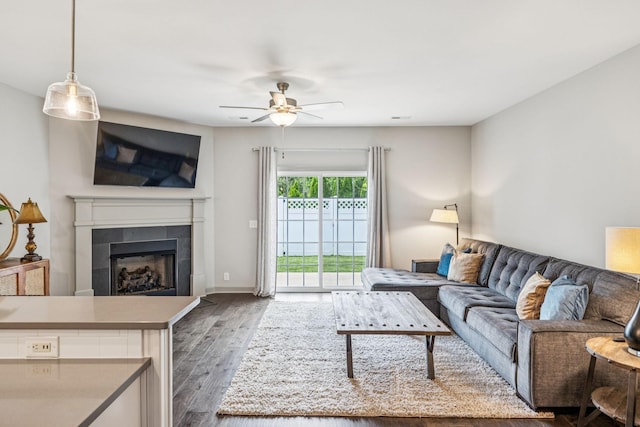 2342 N Tennessee Blvd Unit 1203, Murfreesboro, TN 37130 - living room featuring a ceiling fan, dark wood-style floors, a tile fireplace, and baseboards