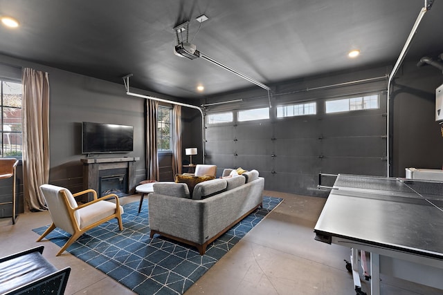 519 Chesterfield Ave Unit 1, Nashville, TN 37212 - living room with concrete flooring, a glass covered fireplace, recessed lighting, and a garage