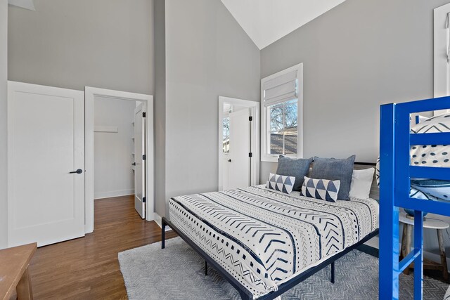 519 Chesterfield Ave Unit 1, Nashville, TN 37212 - bedroom with high vaulted ceiling, wood finished floors, and baseboards