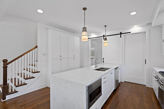 519 Chesterfield Ave Unit 1, Nashville, TN 37212 - kitchen with a sink, appliances with stainless steel finishes, dark wood-type flooring, white cabinets, and recessed lighting