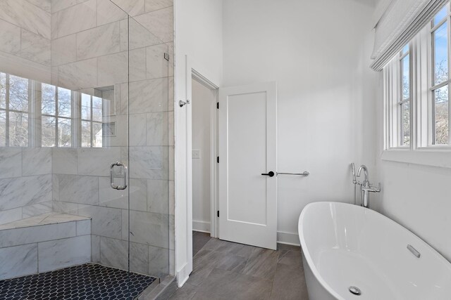 519 Chesterfield Ave Unit 1, Nashville, TN 37212 - full bath with a freestanding tub, a stall shower, and baseboards