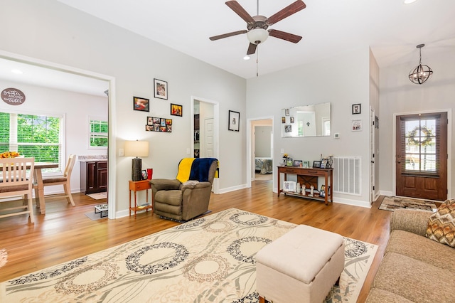 3045 Tacoma Ln, Goodlettsville, TN 37072 - living room with ceiling fan, light wood-style flooring, recessed lighting, baseboards, and a chandelier
