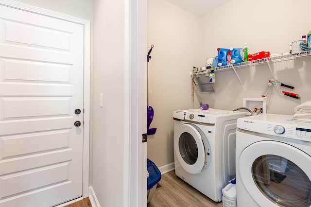 3045 Tacoma Ln, Goodlettsville, TN 37072 - laundry area featuring light wood-style flooring, washer and dryer, and baseboards