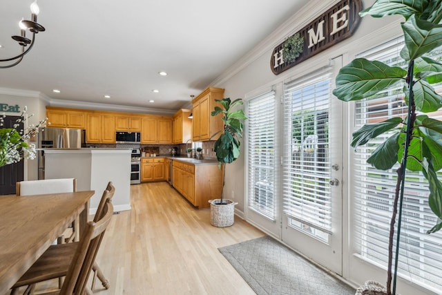 2005 Keene Cir, Spring Hill, TN 37174 - kitchen featuring stainless steel appliances, light wood-style flooring, ornamental molding, tasteful backsplash, and recessed lighting