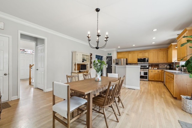 2005 Keene Cir, Spring Hill, TN 37174 - dining space with crown molding, light wood-style floors, a chandelier, recessed lighting, and baseboards