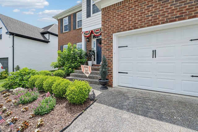 2005 Keene Cir, Spring Hill, TN 37174 - doorway to property with brick siding, a garage, and driveway