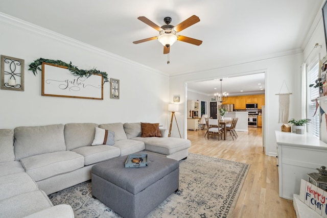 2005 Keene Cir, Spring Hill, TN 37174 - living room featuring a chandelier, ceiling fan, light wood finished floors, and crown molding