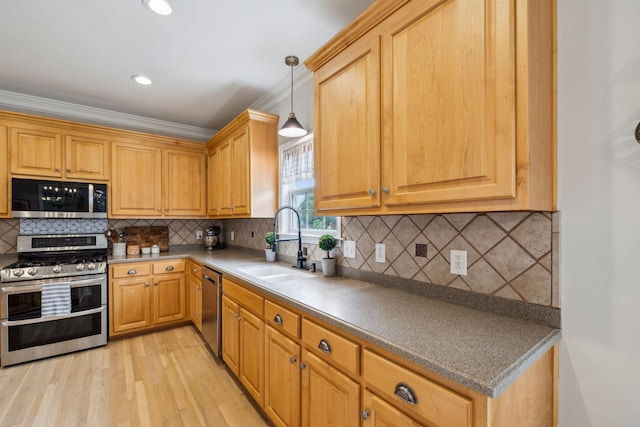 2005 Keene Cir, Spring Hill, TN 37174 - kitchen featuring appliances with stainless steel finishes, a sink, light wood-style flooring, decorative backsplash, and hanging light fixtures