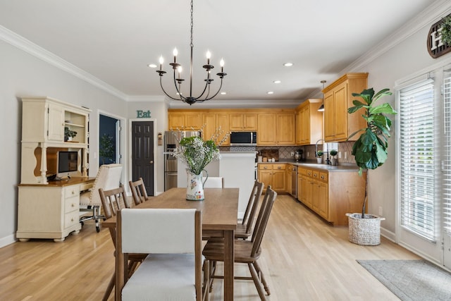 2005 Keene Cir, Spring Hill, TN 37174 - dining space with healthy amount of natural light, light wood-type flooring, crown molding, a chandelier, and recessed lighting