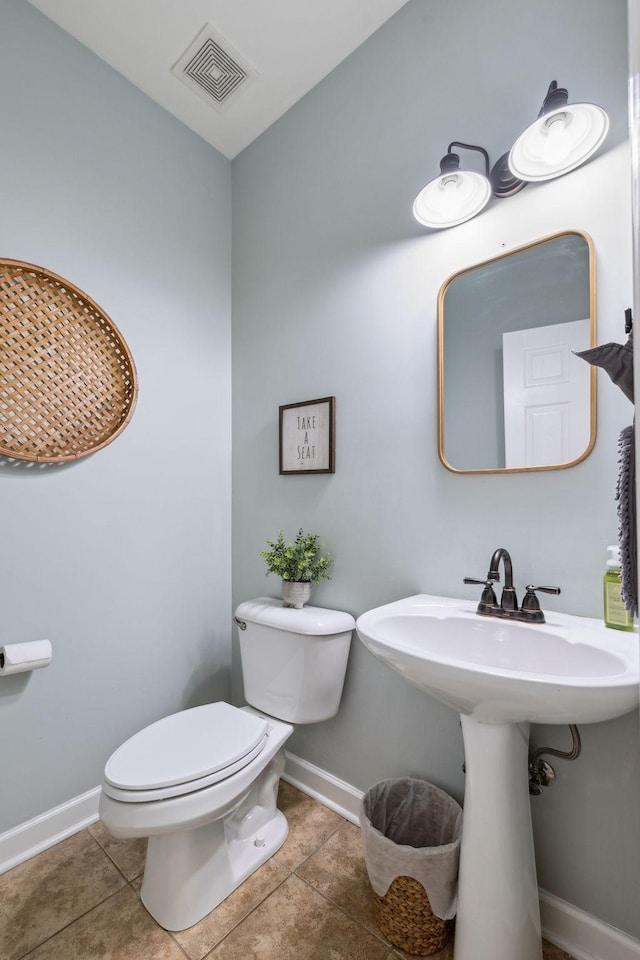 2005 Keene Cir, Spring Hill, TN 37174 - bathroom with toilet, tile patterned floors, baseboards, and a sink