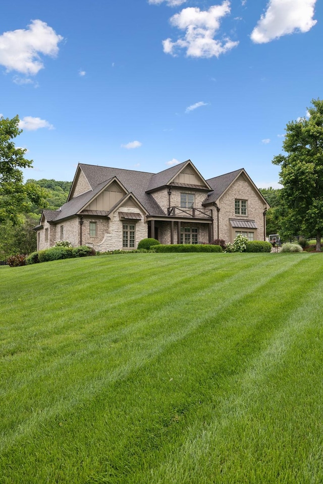 4620 Nadine Ln, Franklin, TN 37064 - view of front of property with stone siding, a front lawn, and board and batten siding