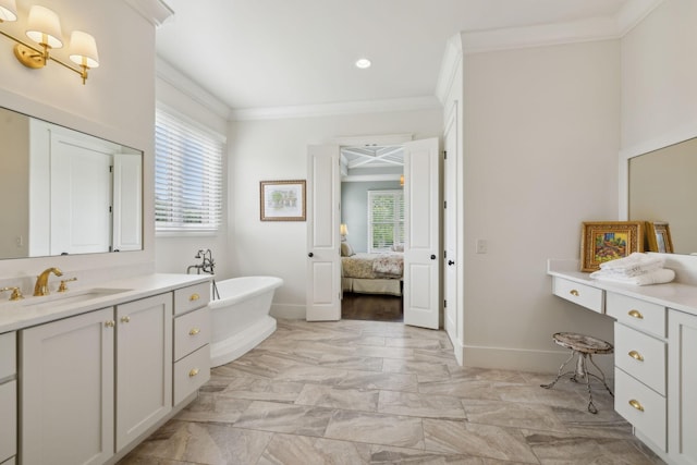4620 Nadine Ln, Franklin, TN 37064 - ensuite bathroom featuring ornamental molding, vanity, a freestanding bath, baseboards, and recessed lighting