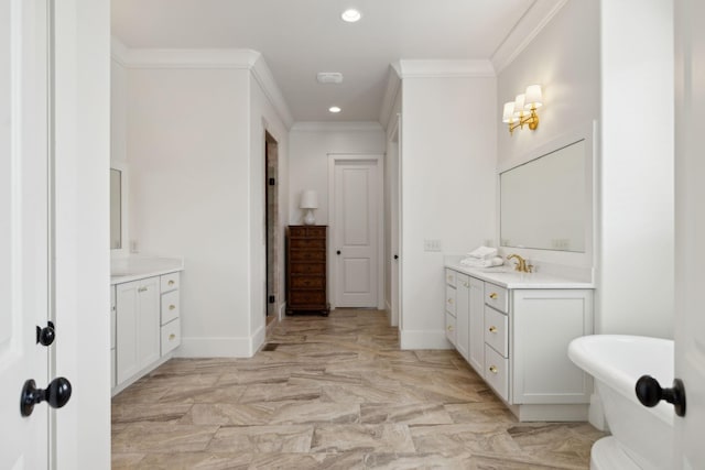 4620 Nadine Ln, Franklin, TN 37064 - bathroom featuring two vanities, baseboards, ornamental molding, recessed lighting, and a soaking tub