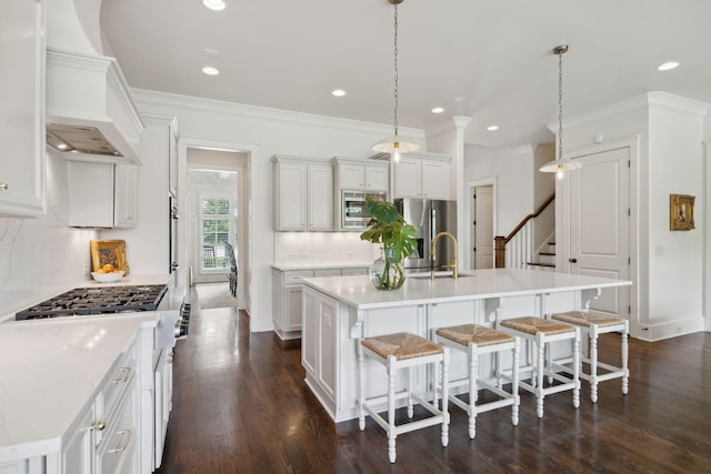 4620 Nadine Ln, Franklin, TN 37064 - kitchen with custom range hood, stainless steel appliances, a sink, decorative backsplash, and light countertops