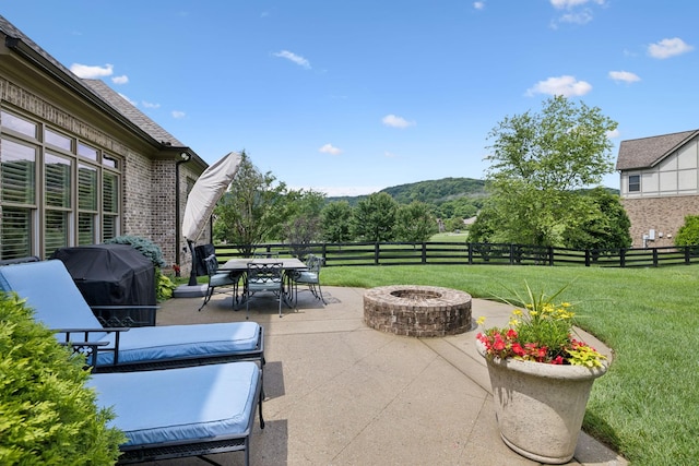 4620 Nadine Ln, Franklin, TN 37064 - view of patio with a fire pit, outdoor dining space, a grill, and a mountain view
