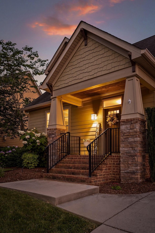 808 Willcrest Dr, Chattanooga, TN 37405 - exterior entry at dusk featuring stone siding and covered porch
