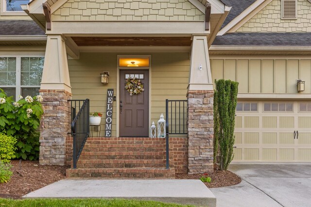 808 Willcrest Dr, Chattanooga, TN 37405 - doorway to property with a shingled roof, board and batten siding, and concrete driveway