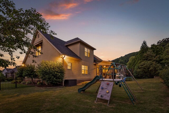 808 Willcrest Dr, Chattanooga, TN 37405 - back of house at dusk with a playground and central AC unit