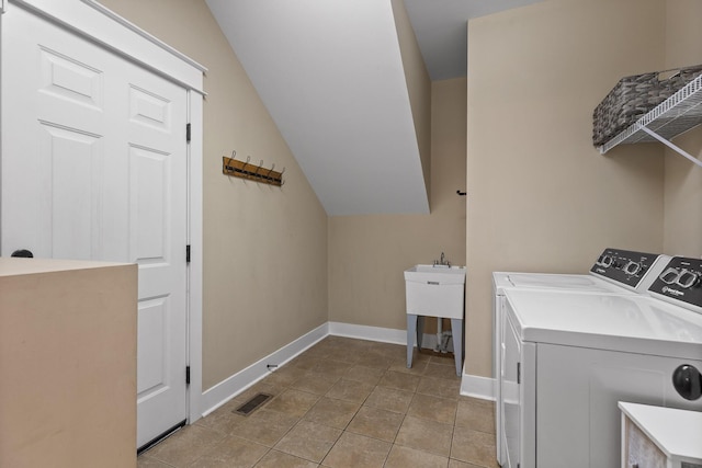 808 Willcrest Dr, Chattanooga, TN 37405 - laundry area with washing machine and clothes dryer, baseboards, and light tile patterned floors