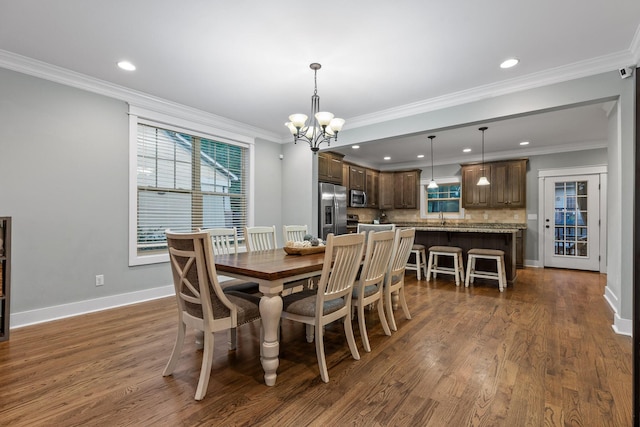 808 Willcrest Dr, Chattanooga, TN 37405 - dining space featuring plenty of natural light, a chandelier, dark wood-style floors, ornamental molding, and baseboards