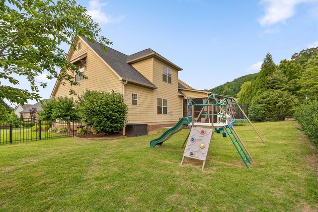808 Willcrest Dr, Chattanooga, TN 37405 - rear view of house featuring a playground, central air condition unit, and a shingled roof