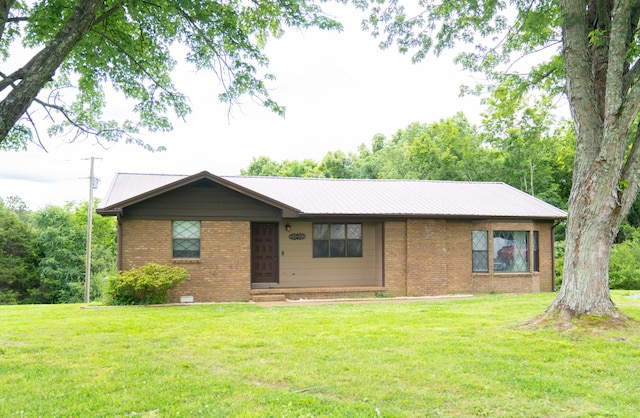 4169 Bledsoe St, Westmoreland, TN 37186 - ranch-style home with brick siding, a front lawn, and metal roof