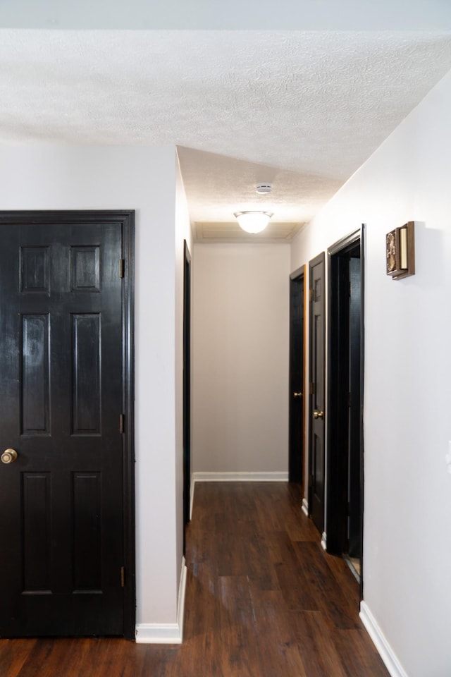 4169 Bledsoe St, Westmoreland, TN 37186 - corridor with dark wood-style floors, baseboards, and a textured ceiling