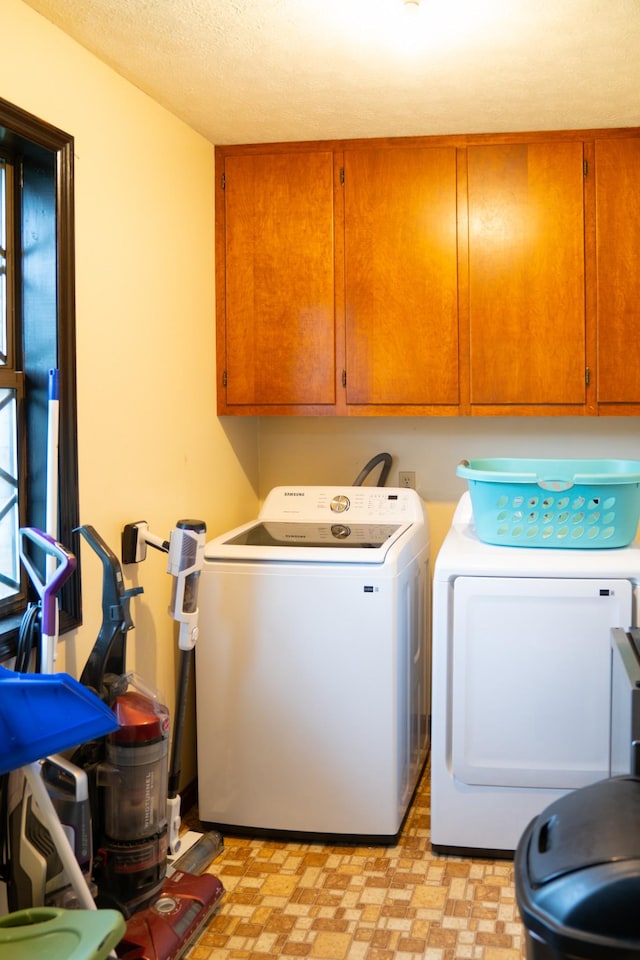 4169 Bledsoe St, Westmoreland, TN 37186 - laundry area featuring cabinet space, washer and clothes dryer, and light floors
