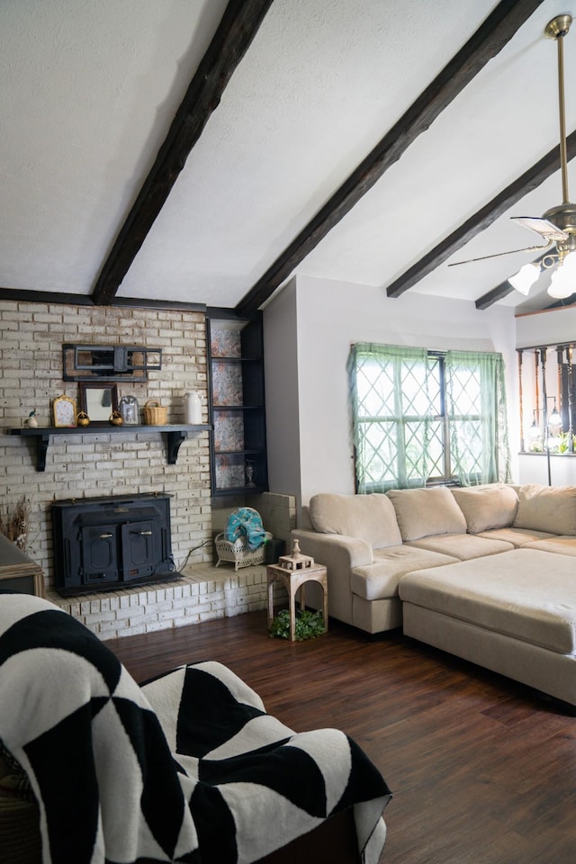 4169 Bledsoe St, Westmoreland, TN 37186 - living room with beam ceiling, a wood stove, wood finished floors, and ceiling fan