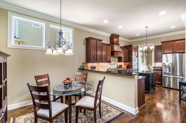 1706 Townsend Blvd, Franklin, TN 37064 - kitchen featuring appliances with stainless steel finishes, a chandelier, premium range hood, dark wood-type flooring, and a peninsula