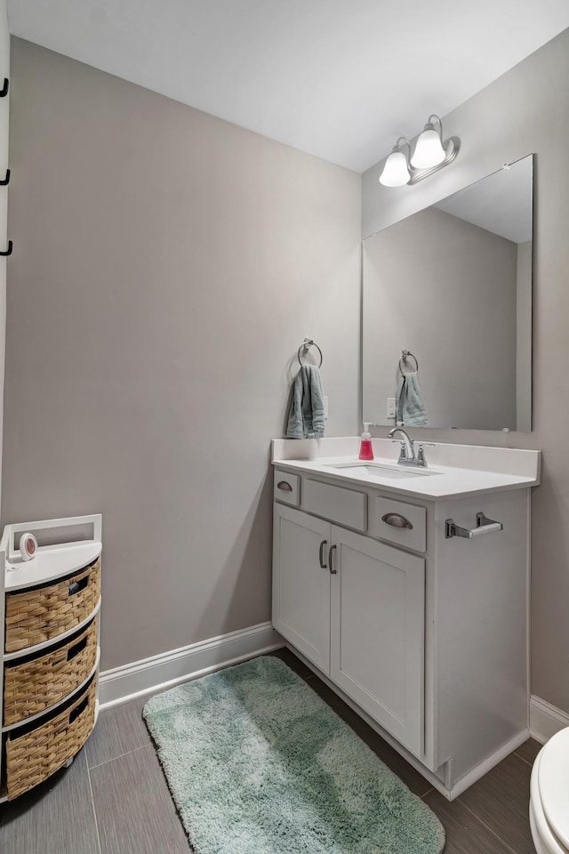 566 Oakvale Ln, Mount Juliet, TN 37122 - half bath with vanity, baseboards, and toilet