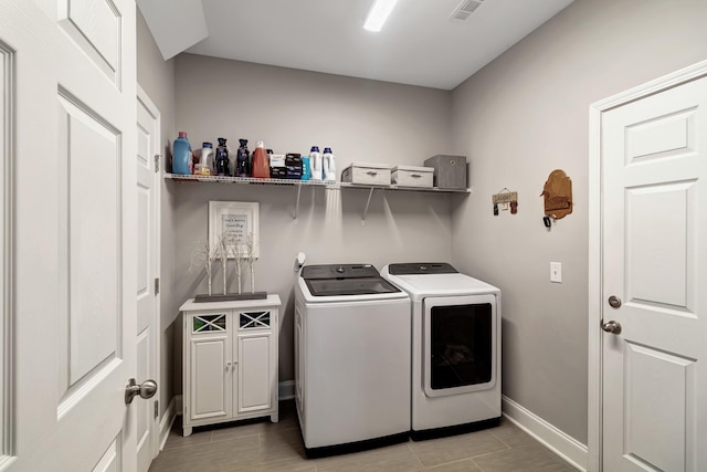 566 Oakvale Ln, Mount Juliet, TN 37122 - washroom with separate washer and dryer, cabinet space, baseboards, and light tile patterned flooring