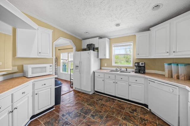 125 Fitzgerald Ave, Celina, TN 38551 - kitchen with white appliances, a sink, white cabinetry, light countertops, and crown molding