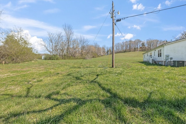 125 Fitzgerald Ave, Celina, TN 38551 - view of green lawn with central AC unit