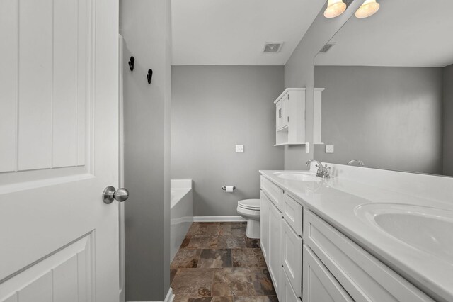 1113 Dunkirk Ln, Murfreesboro, TN 37129 - full bathroom with stone finish flooring, baseboards, toilet, double vanity, and a tub