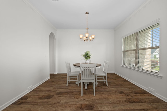1113 Dunkirk Ln, Murfreesboro, TN 37129 - dining space with arched walkways, a chandelier, ornamental molding, wood finished floors, and baseboards