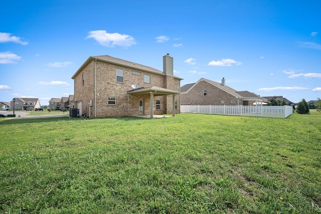 1113 Dunkirk Ln, Murfreesboro, TN 37129 - back of house featuring brick siding, a chimney, and central AC unit