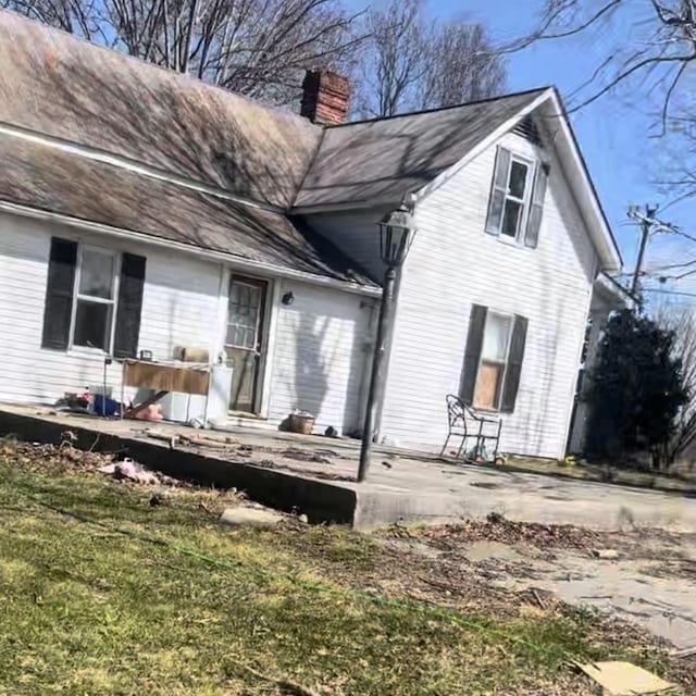239 Pine Bluff Rd, Rock Island, TN 38581 - back of property with a chimney and a lawn