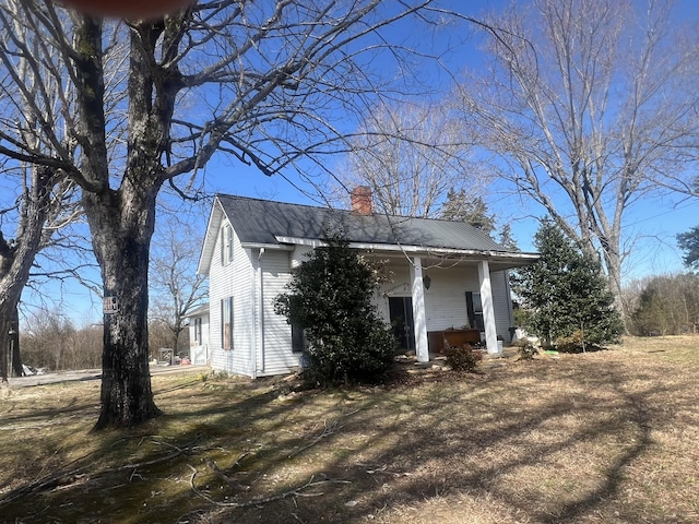 239 Pine Bluff Rd, Rock Island, TN 38581 - view of side of property with a chimney and a porch