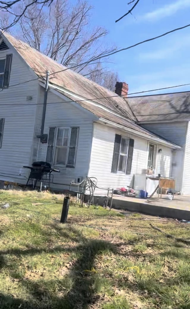 239 Pine Bluff Rd, Rock Island, TN 38581 - back of house with a chimney, a wooden deck, and a lawn