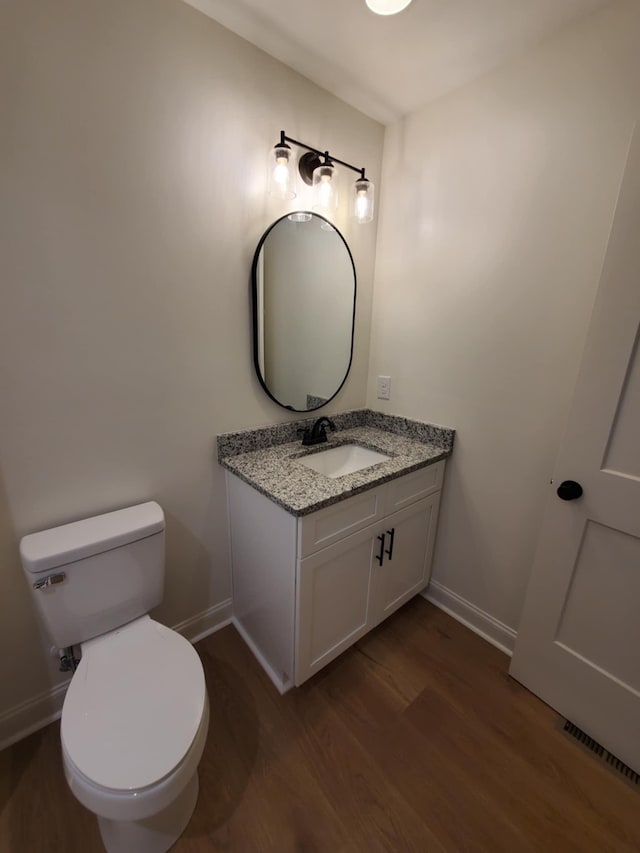 321 Turkey Creek Hwy, Carthage, TN 37030 - half bath with baseboards, wood finished floors, vanity, and toilet