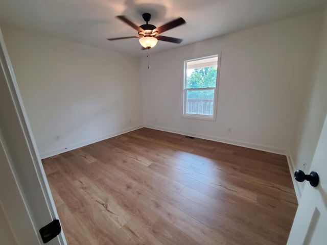 321 Turkey Creek Hwy, Carthage, TN 37030 - empty room with wood finished floors, a ceiling fan, and baseboards