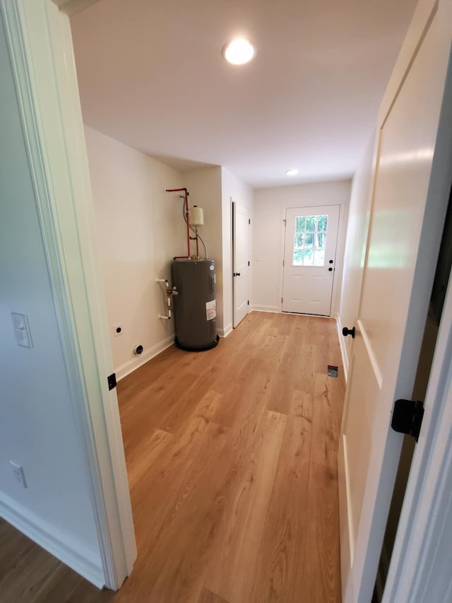321 Turkey Creek Hwy, Carthage, TN 37030 - laundry area featuring water heater, light wood-style flooring, baseboards, and recessed lighting