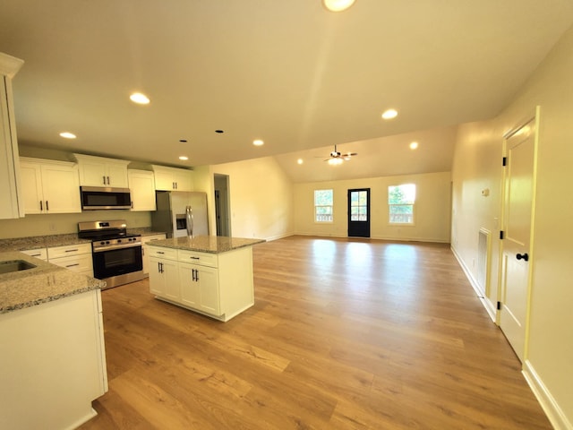 321 Turkey Creek Hwy, Carthage, TN 37030 - kitchen featuring stainless steel appliances, recessed lighting, a center island, light wood-style floors, and light stone countertops