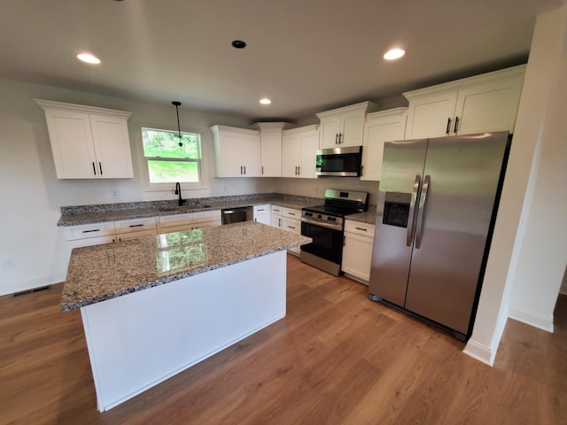 321 Turkey Creek Hwy, Carthage, TN 37030 - kitchen with stainless steel appliances, a sink, white cabinets, and recessed lighting