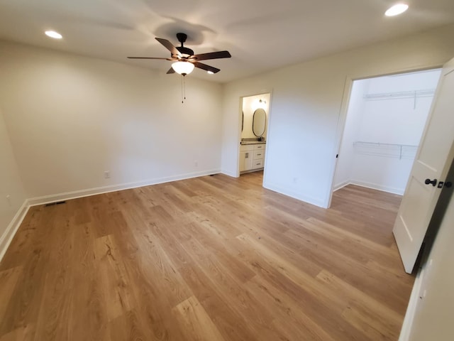 321 Turkey Creek Hwy, Carthage, TN 37030 - unfurnished bedroom featuring recessed lighting, light wood-style floors, baseboards, a spacious closet, and ensuite bath