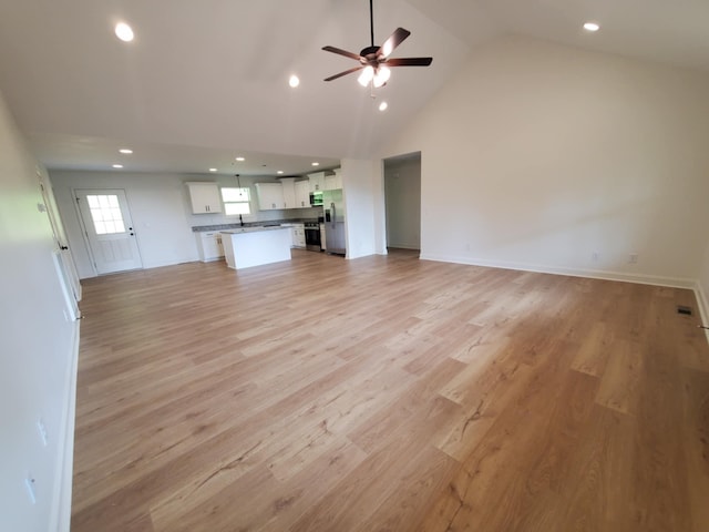 321 Turkey Creek Hwy, Carthage, TN 37030 - unfurnished living room featuring ceiling fan, recessed lighting, light wood-type flooring, baseboards, and high vaulted ceiling