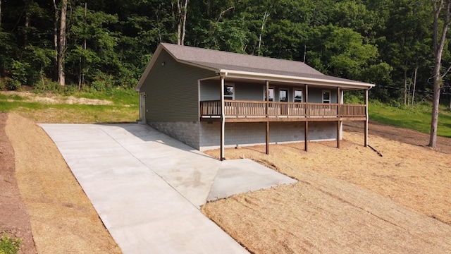 321 Turkey Creek Hwy, Carthage, TN 37030 - view of front facade featuring a view of trees, a deck, and a patio area