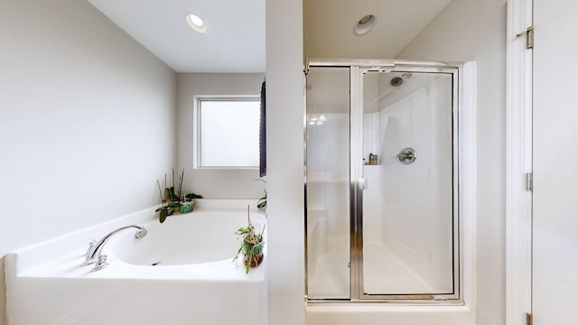5127 Heroes Ln, Murfreesboro, TN 37129 - bathroom featuring a shower stall, a garden tub, and recessed lighting
